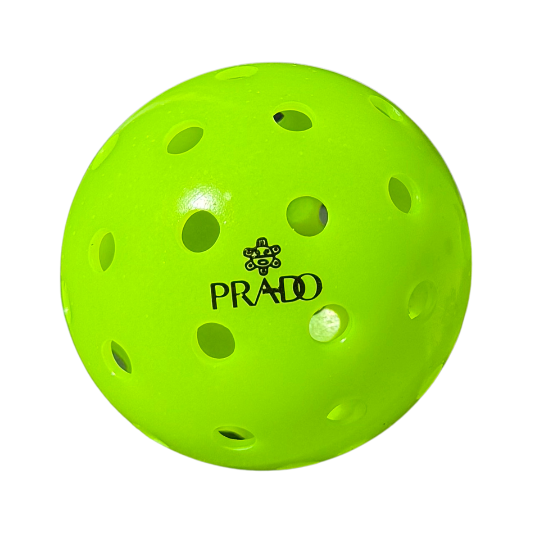 Bright green USAPA pickleball ball with Prado logo and 40 drilled holes for outdoor play durability and performance