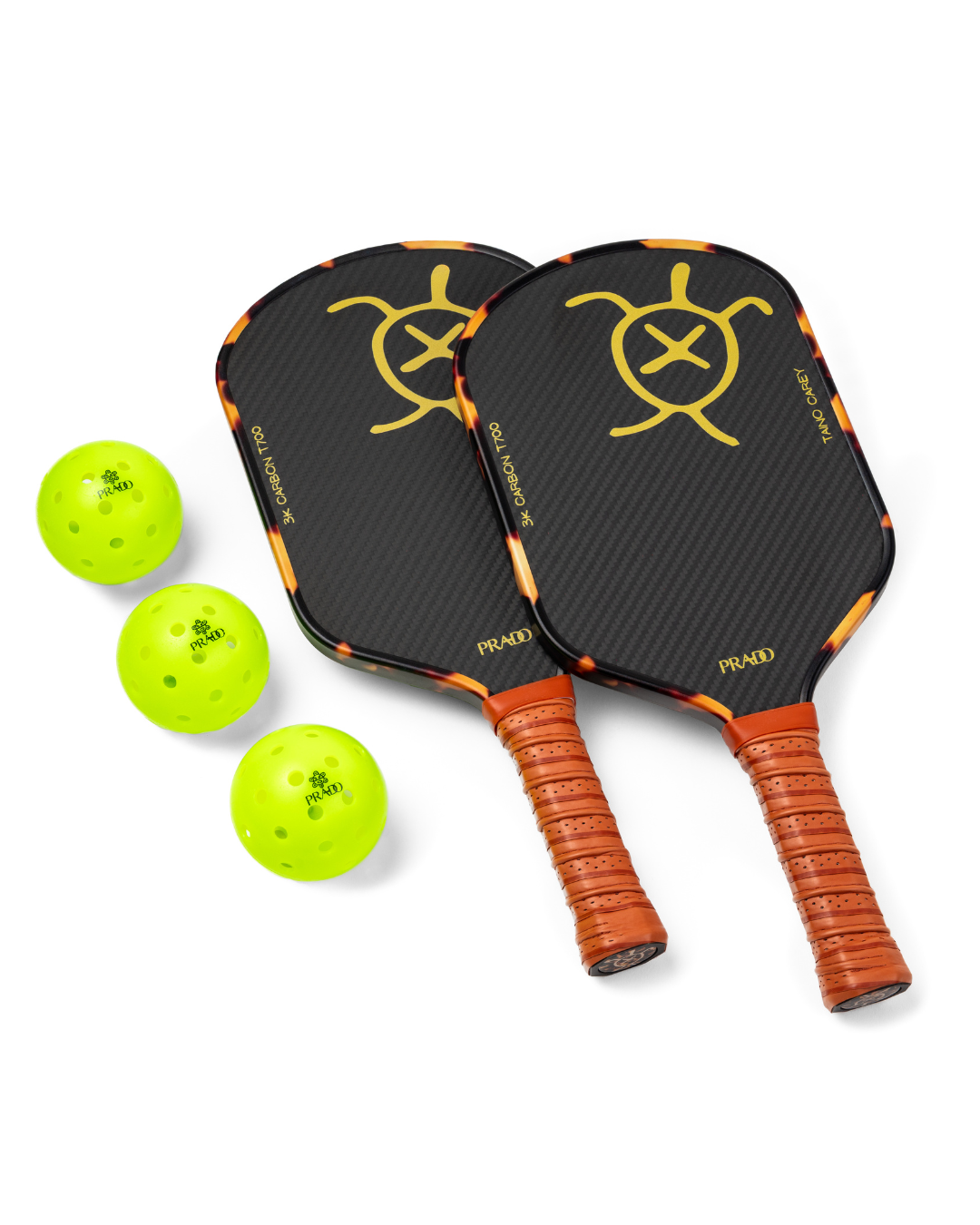 Two Taíno Carey 3K T700 Raw Carbon pickleball paddles with three neon green USAPA-approved balls bundle