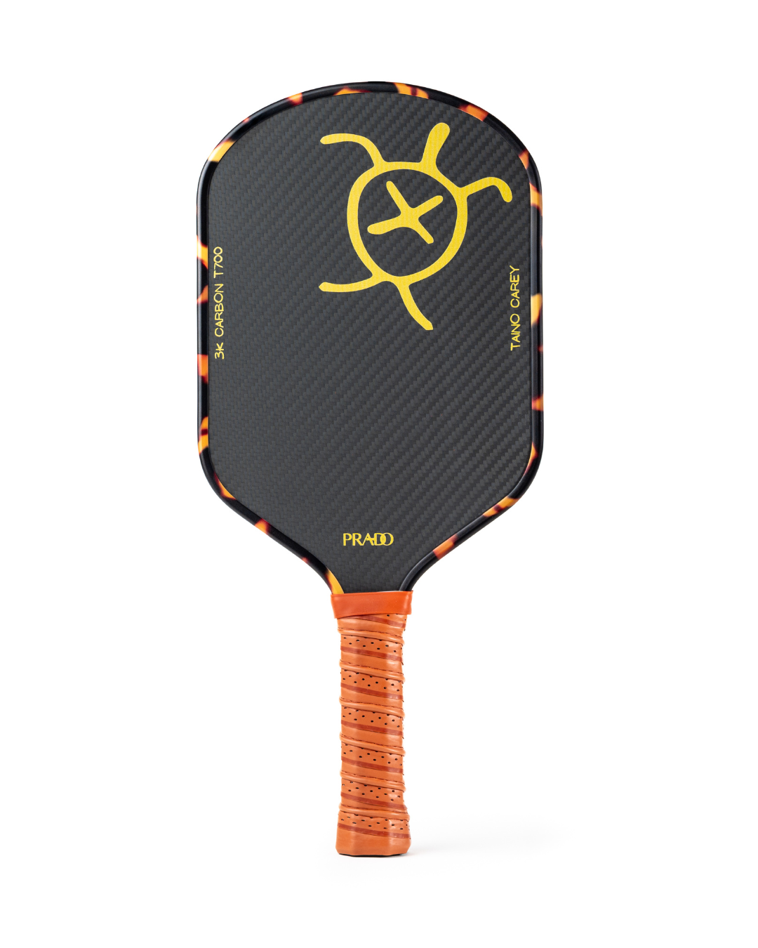 Taíno Carey Paddle with 3K T700 carbon fiber face, 14mm polymer honeycomb core, elongated brown leather handle, and tortoiseshell edge design