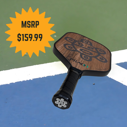 Taino Sun Paddle with Puerto Rican cultural design, T700 carbon fiber, textured surface, and ergonomic handle on pickleball court.